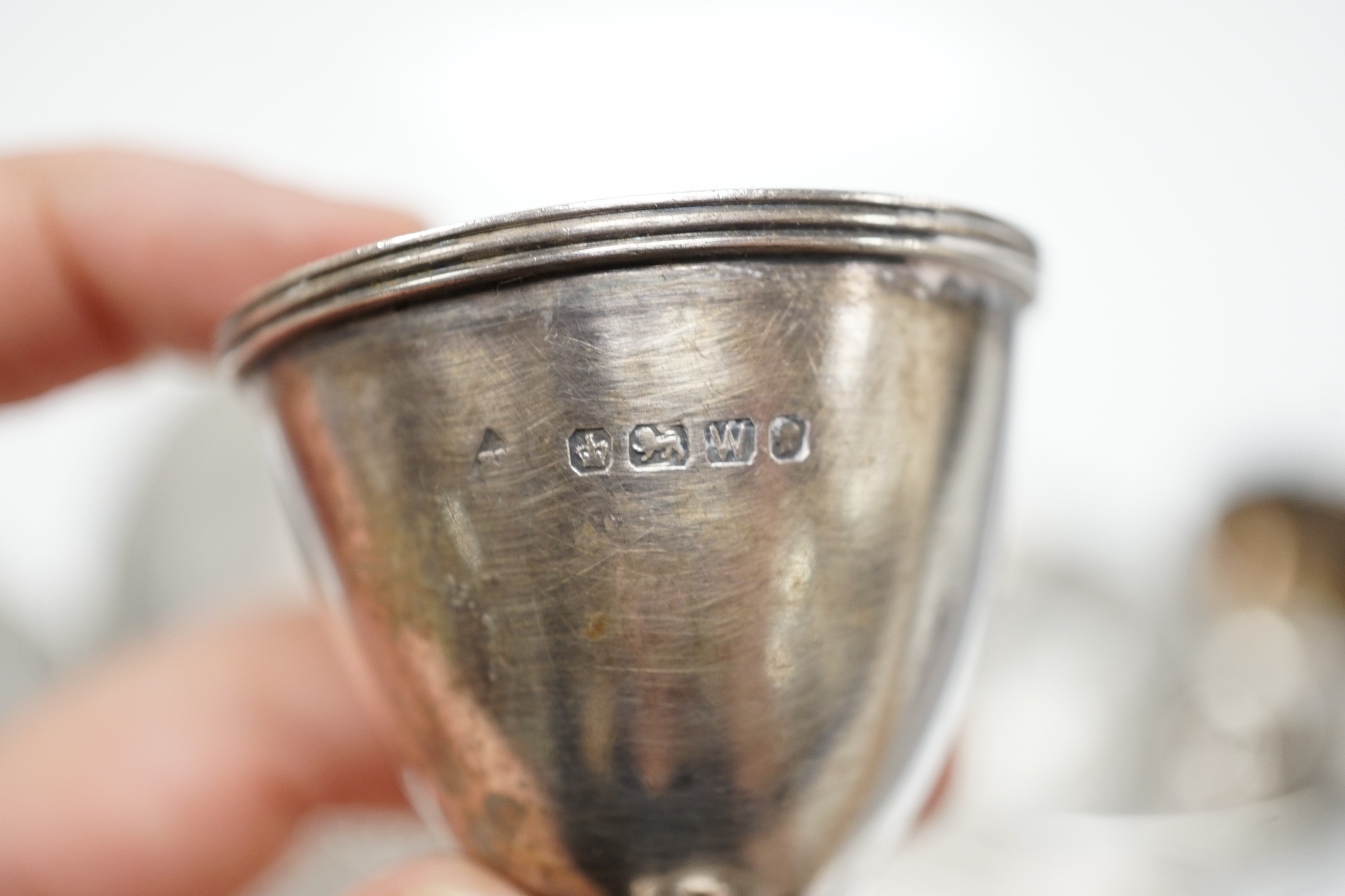 A late Victorian silver egg cruet, Martin, Hall & Co, Sheffield, 1889 (a.f. and lacking spoons), 12.3oz, and a later four piece silver mounted mirror and brush set.